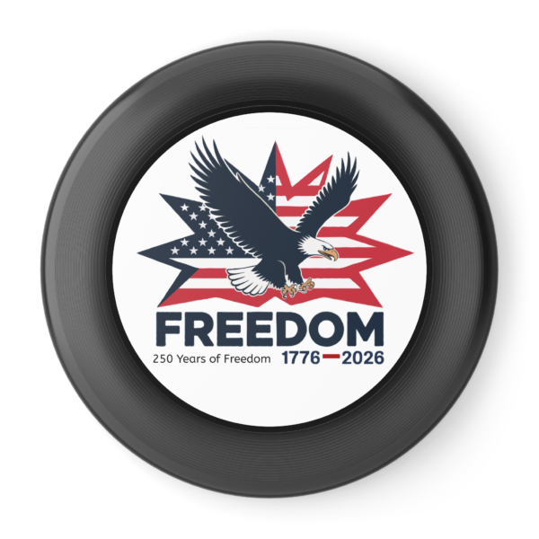 13139064346674134925_2048.webp A flying disc with an image of an eagle in front of a stylized American flag and the word 'FREEDOM' and '250 Years of Freedom 1776-2026'.