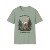 Light green t-shirt with a graphic of a cabin in the woods, a campfire with people sitting around it, and the text 'When the Wi-Fi is Weak... the Connection is Strong'.