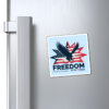15272808049572075460_1200.webp Square magnet on a refrigerator featuring an eagle flying in front of an American flag starburst, with the word "FREEDOM" and the dates 1776-2026.