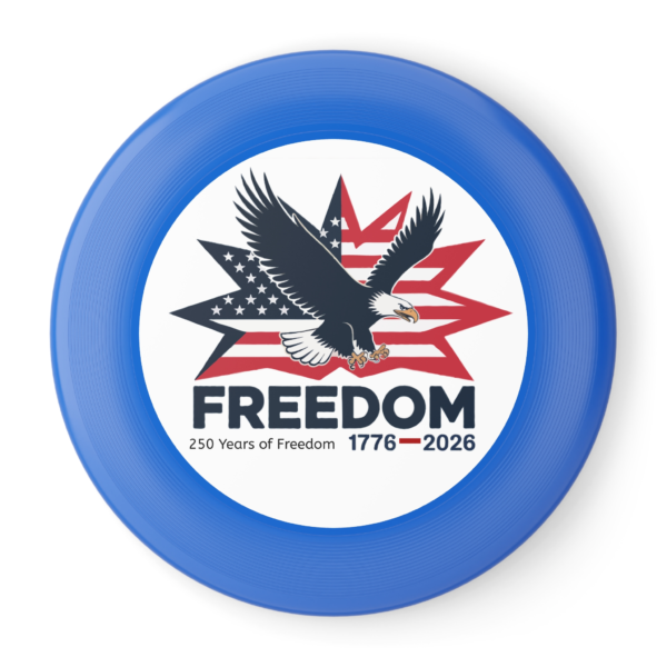 16709404201933577589_2048.webp Blue flying disc featuring an eagle soaring in front of an American flag starburst, with the word 'FREEDOM' and '250 Years of Freedom 1776-2026'.