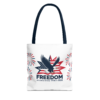 White tote bag with blue handles, featuring a bald eagle design with the word 'FREEDOM' and the dates '1776 to 2026' commemorating 250 years of freedom.