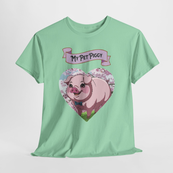 3183003879549548299_2048.webp A light green t-shirt featuring a cartoon pink pig wearing a blue bow tie, set within a heart shape and a banner that reads 'My Pet Piggy'.