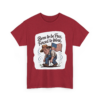 4694130416860506446_2048.webp Maroon t-shirt featuring a cartoon illustration of a farmer with an American flag, and the text 'Born to be Free, Forced to Work'.