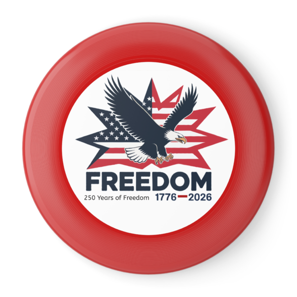 5179933126048054994_2048.webp Red frisbee featuring a bald eagle in front of a stylized American flag and the word "FREEDOM" with "250 Years of Freedom 1776-2026" below it.