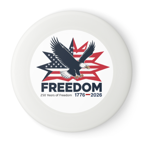 6289865494624496783_2048.webp A white frisbee with a patriotic design featuring a soaring eagle against a backdrop of stylized American flag stripes and stars, and the word 'FREEDOM' above the text '250 Years of Freedom 1776-2026'.