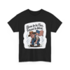 721530853621853897_2048.webp Black t-shirt featuring a cartoon graphic of a farmer in overalls and hat, leaning over as if planting, with an American flag waving behind him, and the text "Born to be Free, Forced to Work".