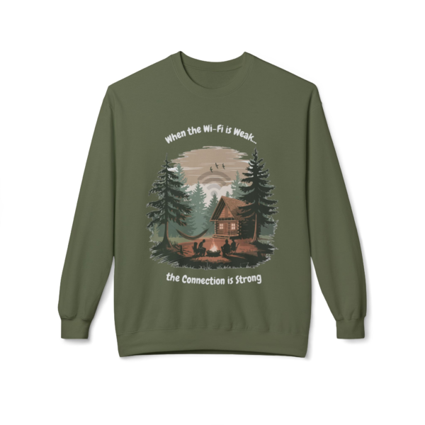 7550069164811393010_2048.webp Olive green sweatshirt with a graphic of a cabin in the woods, people around a campfire, and the text 'When the WiFi is Weak...the Connection is Strong'.